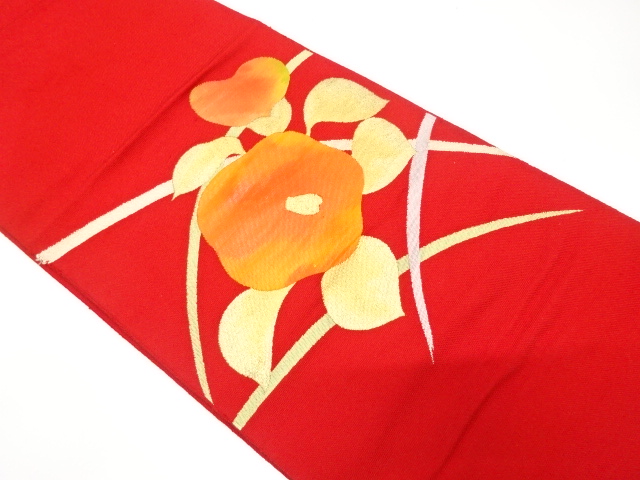 椿に芝草模様織り出し　名古屋帯